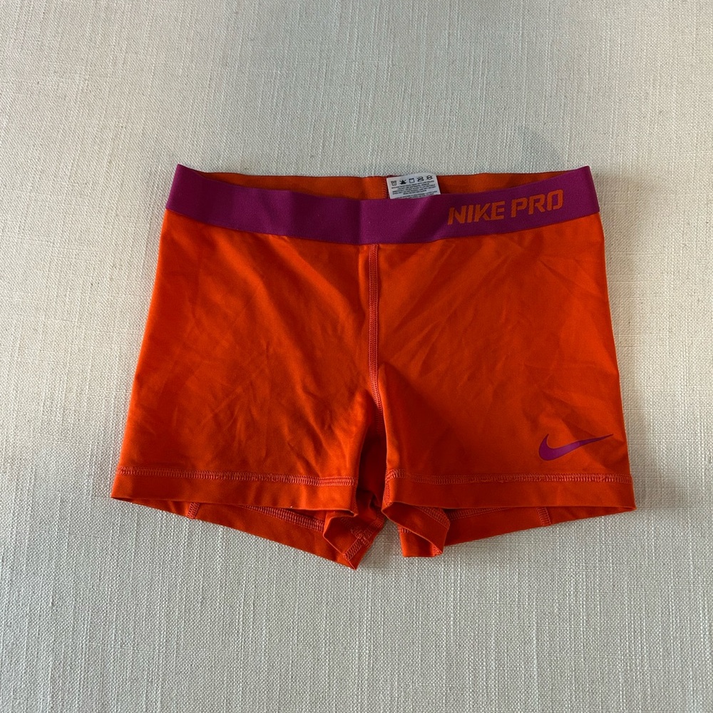 Vibrant Orange Athletic Shorts with Purple Accents